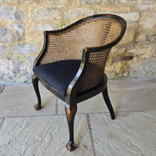 Load image into Gallery viewer, very-attractive-early-20th-century-tub-chair-chinoiserie-decoration-cane-work-seat-shaped-back-black-lacquered-hardwood-frame-cabriole-legs-ball-and-claw-feet-gilt-cinnabar-chinoiserie-decoration-featuring-flowers-foliage-pagoda-style-buildings-upholstered-loose-seat-pad-aesthetically-pleasing-comfortable-chinese-circa-1920-s-for-sale-damon-blandford-antiques-stow-on-the-wold-cotswold-antiques