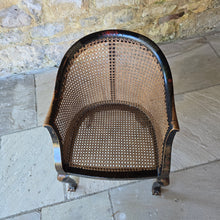 Load image into Gallery viewer, very-attractive-early-20th-century-tub-chair-chinoiserie-decoration-cane-work-seat-shaped-back-black-lacquered-hardwood-frame-cabriole-legs-ball-and-claw-feet-gilt-cinnabar-chinoiserie-decoration-featuring-flowers-foliage-pagoda-style-buildings-upholstered-loose-seat-pad-aesthetically-pleasing-comfortable-chinese-circa-1920-s-for-sale-damon-blandford-antiques-stow-on-the-wold-cotswold-antiques