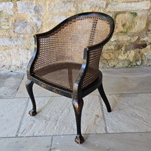 Load image into Gallery viewer, very-attractive-early-20th-century-tub-chair-chinoiserie-decoration-cane-work-seat-shaped-back-black-lacquered-hardwood-frame-cabriole-legs-ball-and-claw-feet-gilt-cinnabar-chinoiserie-decoration-featuring-flowers-foliage-pagoda-style-buildings-upholstered-loose-seat-pad-aesthetically-pleasing-comfortable-chinese-circa-1920-s-for-sale-damon-blandford-antiques-stow-on-the-wold-cotswold-antiques