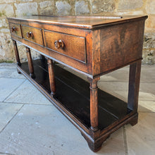Load image into Gallery viewer, good-early-19th-century-welsh-oak-dresser-base-three-drawers-cock-beading-original-turned-wooden-drawer-pulls-apron-applied-moulded-edge-turned-supports-pot-board-bracket-feet-good-colour-excellent-condition-for-sale-damon-blandford-antiques-stow-on-the-wold-cotswolds