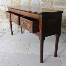 Load image into Gallery viewer, really-good-colour-provincial-cherrywood-serving-console-sofa-table-george-II-III-georgian-two-plank-top-applied-mouldings-three-drawers-rebated-butt-joint-construction-carved-cock-beading-pierced-brass handles-escutcheons-apron-panels-circular-tapered-legs-incredibly-attractive-table-fabulous-patination-good-usable-condition-time-worn-appearance-tremendous-aesthetic-appeal-small-proportions-northern-england-circa-1760-for-sale-damon-blandford-antiques-stow-on-the-wold-cotswolds-decorative-interiors-design