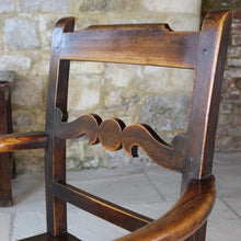 Load image into Gallery viewer, good-colour-early-19th-century-elm-open-armchair-originating-from-north-wales-square-styles-rails-stepped-top-rail-decorative-middle-rail-with-central-roundal-between-two-serpentine-shaped-elements-serpentine-shape-arms-arm-supports-decorative-chair-two-plank-elm-seat-square-legs-united-by-stretchers-wonderful-patina-contrasting-black-golden-honey-colours-particularly-attractive-traditional-contemporary-for-sale-damon-blandford-antiques-stroud-stow-on-the-wold-cotswolds-regional-furniture