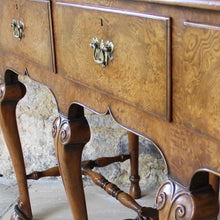Load image into Gallery viewer, very-fine-quality-queen-anne-revival-serving-console-table-by-hamptons-pall-mall-london-beautifully-figured-pollard-oak-top-with-moulded-edge-drawers-brass-drop-handles-shaped-frieze-particularly-attractive-eight-crisply-carved-cabriole-legs-hoof-feet-united-by-turned-stretches-stylish-london-cabinet-makers-excellent-condition-wonderful-colour-console-sofa-table-tremendous-traditional-contemporary-settings-english-circa-1900-for-sale-damon-blandford-antiques-stow-on-the-wold-furniature-interior