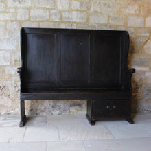 Load image into Gallery viewer, painted-pine-and-elm-settle-three-panels-along-back-framed-by-moulded-stiles-winged-ends-bench-seat-single-drawer-swan-neck-handle-useful-storage space-shaped-winged-ends-concave-arms-particularly-attractive-vernacular-furniture-original-black-brown-painted-finish-fabulous-contrasting-golden-honey-colour-settle-excellent-condition-regional-furniture-hallway-boot-room-kitchen-english-early-1800's-for-sale-damon-blandford-antiques-stroud-stow-on-the-wold-cotswolds-country-interior-home-design