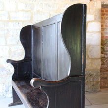 Load image into Gallery viewer, painted-pine-and-elm-settle-three-panels-along-back-framed-by-moulded-stiles-winged-ends-bench-seat-single-drawer-swan-neck-handle-useful-storage space-shaped-winged-ends-concave-arms-particularly-attractive-vernacular-furniture-original-black-brown-painted-finish-fabulous-contrasting-golden-honey-colour-settle-excellent-condition-regional-furniture-hallway-boot-room-kitchen-english-early-1800's-for-sale-damon-blandford-antiques-stroud-stow-on-the-wold-cotswolds-country-interior-home-design