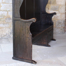 Load image into Gallery viewer, painted-pine-and-elm-settle-three-panels-along-back-framed-by-moulded-stiles-winged-ends-bench-seat-single-drawer-swan-neck-handle-useful-storage space-shaped-winged-ends-concave-arms-particularly-attractive-vernacular-furniture-original-black-brown-painted-finish-fabulous-contrasting-golden-honey-colour-settle-excellent-condition-regional-furniture-hallway-boot-room-kitchen-english-early-1800's-for-sale-damon-blandford-antiques-stroud-stow-on-the-wold-cotswolds-country-interior-home-design