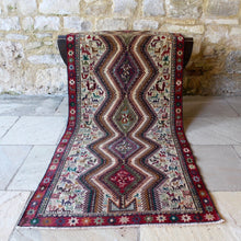 Load image into Gallery viewer, stunning-sumac-runner-featuring-six-adjoined-central-medallions-profusion-of-ark-animal-motifs-main-boarder-star-motifs-red-ground-happiness-fertility-noah's-ark-mount-ararat-eastern-anatolia-Iran. Sumac-loom-kilims-weaving-technic-anatolia-circa-1950's-for-sale-damon-blandford-antiques-phil-taylors-cool-stuff-stroud-gloucestershire-cotswolds-interior