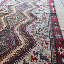 Load image into Gallery viewer, stunning-sumac-runner-featuring-six-adjoined-central-medallions-profusion-of-ark-animal-motifs-main-boarder-star-motifs-red-ground-happiness-fertility-noah's-ark-mount-ararat-eastern-anatolia-Iran. Sumac-loom-kilims-weaving-technic-anatolia-circa-1950's-for-sale-damon-blandford-antiques-phil-taylors-cool-stuff-stroud-gloucestershire-cotswolds-interior