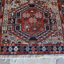 Load image into Gallery viewer, attractive-kilim-rug-hand-woven-loom-shahsevan-nomadic-people-tribe-northwestern-region-iran-design-features-three-large-central-medallions-cream-ground-surrounded-main-border-repeating-star-motifs-symbolising-happiness-fertility-stylised -bird-animal-motifs-predominantly-burnt-orange-cream-blue-colour-1960s-for-sale-damon-blandford-antiques-stroud-cotswolds-carpet-interior-floor