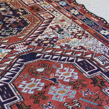 Load image into Gallery viewer, attractive-kilim-rug-hand-woven-loom-shahsevan-nomadic-people-tribe-northwestern-region-iran-design-features-three-large-central-medallions-cream-ground-surrounded-main-border-repeating-star-motifs-symbolising-happiness-fertility-stylised -bird-animal-motifs-predominantly-burnt-orange-cream-blue-colour-1960s-for-sale-damon-blandford-antiques-stroud-cotswolds-carpet-interior-floor
