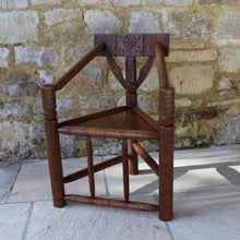 Load image into Gallery viewer, copy-of-the-old-saxon-chair-from-lord-leycesters-hospital-warwick-chair-of-ttriangular-form-chip-carved-to-same-design-by-victorian-chair-maker-john-starkey-further-example-victoria-and-albert-museum-london-comfortable-excellent-original-condition-new-bespoke-velvet-cushion-for-sale-damon-blandford-antiques-stroud-cotswolds-seating