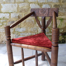 Load image into Gallery viewer, copy-of-the-old-saxon-chair-from-lord-leycesters-hospital-warwick-chair-of-ttriangular-form-chip-carved-to-same-design-by-victorian-chair-maker-john-starkey-further-example-victoria-and-albert-museum-london-comfortable-excellent-original-condition-new-bespoke-velvet-cushion-for-sale-damon-blandford-antiques-stroud-cotswolds-seating