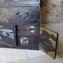 Load image into Gallery viewer, decorative-japanese-tansu-chest-fourth-quarter-edo-period-traditional-japanese-two-part-chest-iron-carry-handles-storing-clothing-decorated-chinoiserie-overlay-featuring-flowers-foliage-black-ground-long-short-drawers-door-drop-handles-incredibly-attractive-useful-storage-furniture-very-good-condition-japan-circa-1840-60-for-sale-damon-blandford-antiques-stroud-stow-on-the-wold-cotswolds-home-interior