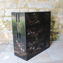 Load image into Gallery viewer, decorative-japanese-tansu-chest-fourth-quarter-edo-period-traditional-japanese-two-part-chest-iron-carry-handles-storing-clothing-decorated-chinoiserie-overlay-featuring-flowers-foliage-black-ground-long-short-drawers-door-drop-handles-incredibly-attractive-useful-storage-furniture-very-good-condition-japan-circa-1840-60-for-sale-damon-blandford-antiques-stroud-stow-on-the-wold-cotswolds-home-interior