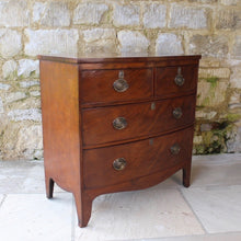 Load image into Gallery viewer, Attractive-early-19th-century-mahogany-bow-fronted-chest-of-drawers-bracket-feet-splayed at-foot-top-cross-banded-satinwood-stringing-two-short-two-long-drawers-cock-beading-drop-handles-drawers-lined-in-mahogany-fine-dovetailing-small-proportions-well-figured-veneer-particular-attractive-for-sale-damon-blandford-antiques-stroud-cotswolds-antique-storage