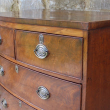Load image into Gallery viewer, Attractive-early-19th-century-mahogany-bow-fronted-chest-of-drawers-bracket-feet-splayed at-foot-top-cross-banded-satinwood-stringing-two-short-two-long-drawers-cock-beading-drop-handles-drawers-lined-in-mahogany-fine-dovetailing-small-proportions-well-figured-veneer-particular-attractive-for-sale-damon-blandford-antiques-stroud-cotswolds-antique-storage