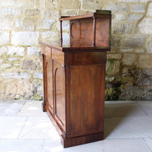 Load image into Gallery viewer, Attractive-victorian-mahogany-chiffonier-well-figured-flame-mahogany-veneers-upper-shelf-turned-mahogany-supports-form-of-classical-columns-frieze-drawers-cupboard-doors-oval-panels-storage-space-height-adjustable-shelves-plinth-base-elegant-highly-functional-design-clean-classical-lines-for-sale-damon-blandford-antiques-stow-on-the-wold-cotswolds-for-sale-damon-blandford-antiques-antique-storage-solutions