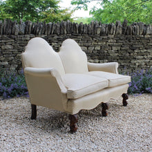 Load image into Gallery viewer, excellent-quality-two-seater-jacobean-revival-settee-generous-proportions-camel-back-scrolled-arms-loose-feather-cushion-seat-pads-shaped-frieze-carved-show-wood-legs-square-swept-legs-rear-beautifully-upholstered-high-quality-cream-green-colour-fabric-piped-edging-english-circa-1900-for-sale-damon-blandford-antiques-cotswolds-seating