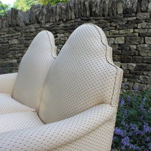 Load image into Gallery viewer, excellent-quality-two-seater-jacobean-revival-settee-generous-proportions-camel-back-scrolled-arms-loose-feather-cushion-seat-pads-shaped-frieze-carved-show-wood-legs-square-swept-legs-rear-beautifully-upholstered-high-quality-cream-green-colour-fabric-piped-edging-english-circa-1900-for-sale-damon-blandford-antiques-cotswolds-seating