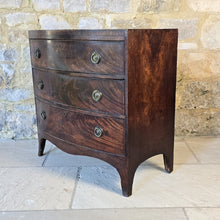 Load image into Gallery viewer, Excellent-example-late-18th-early-19th-century-flame-mahogany-bow-fronted-chest-three-graduated-drawers-wonderful-colour-patination-loved-generation-family-central-london-chelsea-kings-road-fulham-alton-hampshire-war-bonnett-elegant-excellent-condition-for-sale-damon-blandford-antiques-stow-on-the-wold-cotswolds-antique-storage-furniture