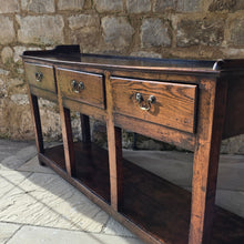 Load image into Gallery viewer, excellent-colour-georgian-oak-dresser-with-open-rack-three-shelves-moulded-cornice-hand-forged-iron-hooks-drawers-lined-in-pine-drawer-fronts-moulded-edges-brass-swan-neck-drop-handles-raised-on-primitive-supports-pot-board-excellent-condition-fresh-to-market-circa-1780-1800-for-sale-damon-blandford-antiques-stow-on-the-wold-kitchen-dinning-room-furniture