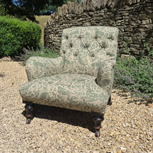 Load image into Gallery viewer, good-excellent-quality-mid-19th-century-armchair-upholstered-chair-shaped-button-back-curved-upholstered-arms-style-of-Howard-&-Sons-ebonised-turned-legs-brass-castors-black-ceramic-wheels-square-swept-legs-rear-incredibly-comfortable armchair-newly-re-upholstered-high-quality-printed-linen-featuring-bird-hare-motifs-attractive-for-sale-low-library-chair-damon-blandford-antiques-stow-on-the-wold-cotswolds