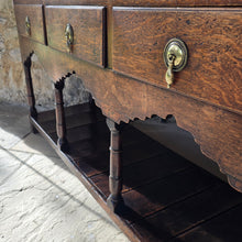 Load image into Gallery viewer, good-colour-georgian-welsh-oak-dresser-with-rack-constructed-from-well-figured-timbers-dresser-comprises-three-drawers-above-cupids-bow-shap- frieze-turned-supports-pot-board-excellent-condition-fresh-to-market-attractive-useful-furniture-south-wales-circa-1790-1810-good-original-condition-for-sale-damon-blandford-antiques-stow-on-the-wold