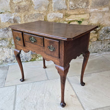 Load image into Gallery viewer, Good-colour-early-georgian-oak-side-table-lowboy-three-overlapping-drawers-ovolo-mouldings-retaining-original-brass-handles-shaped-frieze-cabriole-legs-pad-feet-solid-stable-condition-honest-attractive-useful-english-circa-1720s-for-sale-damon-blandford-antiques-stow-on-the-wold-cotswolds