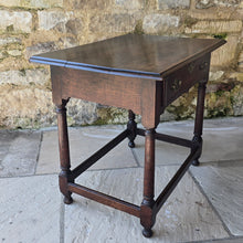 Load image into Gallery viewer, early-george-II-oak-side-table-exceptionally-good-colour-condition-overhung- top-ogee-moulding above-full-width-frieze-drawer-brass-handles-escutcheon-plate-well-turned-gun-barrel-legs-ring-turned-details-feet-outward-edged-stretches-english-circa-1730-for-sale-damon-blandford-antiques-stow-on-the-wold-cotswolds