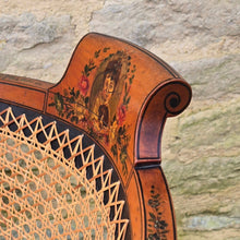 Load image into Gallery viewer, fine-19th-century-adam-style-bergère-arm-chair-generous-wide-deep-proportions-concave-arm-supports-square-tapered-swept-legs-brass-castors-satinwood-frame-painted-neo-classical-design-foliage-flowers-line-decoration-scrolled-crest-rail-young-lady-spaniel-cane-work-seat-back-rest-excellent-original-condition-good-vibrant-colours-excellent-example-aesthetic-appeal-for-sale-damon-blandford-antiques-stow-on-the-wold-cotswolds