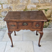 Load image into Gallery viewer, Good-colour-early-georgian-oak-side-table-lowboy-three-overlapping-drawers-ovolo-mouldings-retaining-original-brass-handles-shaped-frieze-cabriole-legs-pad-feet-solid-stable-condition-honest-attractive-useful-english-circa-1720s-for-sale-damon-blandford-antiques-stow-on-the-wold-cotswolds