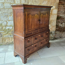 Load image into Gallery viewer, Good-well-proportioned-furniture-early19th- oak—court-cupboard-excellent-storage-top-section-canted-corners-spiral-design-flanking-ogee-panel-doors-shelf-moulded-cornice-mahogany-band-bottom-section-cock-bead-drawers-lined-pine-turned-wooden-drawer-pulls-bracket-feet-excellent-condition-good-warm-honey-colour-tones-North-West-Welsh-Borders-circa-1810-1820-for-sale-damon-blandford-antiques-stow-on-the-wold-early-oak