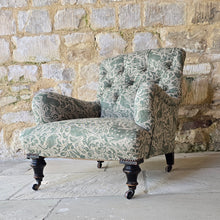 Load image into Gallery viewer, good-excellent-quality-mid-19th-century-armchair-upholstered-chair-shaped-button-back-curved-upholstered-arms-style-of-Howard-&-Sons-ebonised-turned-legs-brass-castors-black-ceramic-wheels-square-swept-legs-rear-incredibly-comfortable armchair-newly-re-upholstered-high-quality-printed-linen-featuring-bird-hare-motifs-attractive-for-sale-low-library-chair-damon-blandford-antiques-stow-on-the-wold-cotswolds