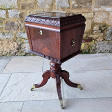 Load image into Gallery viewer, Good-quality-early-19th-century-Irish-cellarette-sarcophagus-form-pedestal-base-carved-acanthus-leaves-gadrooned-rope-twist-mouldings-brass-lion-mask-ring-carry-handles-oval-escutcheon-plate-original-lock-key-quadra-form-base-reeded-sabre-legs-hipped-carved-foliate-decoration-terminating-brass-box-toe-castors-furniture-excellent-colour-condition-patena-for-sale-damon-blandford-antiques-stow-on-the-wold-stroud-cotswolds-antique-drinks-bottles-storage