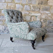Load image into Gallery viewer, good-excellent-quality-mid-19th-century-armchair-upholstered-chair-shaped-button-back-curved-upholstered-arms-style-of-Howard-&-Sons-ebonised-turned-legs-brass-castors-black-ceramic-wheels-square-swept-legs-rear-incredibly-comfortable armchair-newly-re-upholstered-high-quality-printed-linen-featuring-bird-hare-motifs-attractive-for-sale-low-library-chair-damon-blandford-antiques-stow-on-the-wold-cotswolds