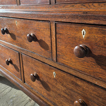 Load image into Gallery viewer, Good-well-proportioned-furniture-early19th- oak—court-cupboard-excellent-storage-top-section-canted-corners-spiral-design-flanking-ogee-panel-doors-shelf-moulded-cornice-mahogany-band-bottom-section-cock-bead-drawers-lined-pine-turned-wooden-drawer-pulls-bracket-feet-excellent-condition-good-warm-honey-colour-tones-North-West-Welsh-Borders-circa-1810-1820-for-sale-damon-blandford-antiques-stow-on-the-wold-early-oak