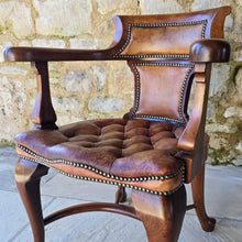 Load image into Gallery viewer, Excellent-condition-19th-century-bow-backed-elbow-captains-desk-chair-generous-proportions-incredibly-sturdy-constructed-in-oak-padded-tan-colour-hide-scroll-buttoned seat-raised-on-cabriole-legs-united-crinoline-stretcher.
Chair-very-well-constructed-noticeably-heavy-quality-timber-excellent-condition-age-related-wear-aesthetic-appeal-comfortable-supportive-large-desk-writing-table-good-quality-furniture-for-sale-damon-francis-blandford-stow-on-the-wold-cotswolds