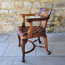 Load image into Gallery viewer, Excellent-condition-19th-century-bow-backed-elbow-captains-desk-chair-generous-proportions-incredibly-sturdy-constructed-in-oak-padded-tan-colour-hide-scroll-buttoned seat-raised-on-cabriole-legs-united-crinoline-stretcher.
Chair-very-well-constructed-noticeably-heavy-quality-timber-excellent-condition-age-related-wear-aesthetic-appeal-comfortable-supportive-large-desk-writing-table-good-quality-furniture-for-sale-damon-francis-blandford-stow-on-the-wold-cotswolds