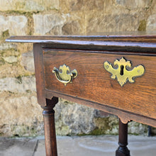 Load image into Gallery viewer, early-george-II-oak-side-table-exceptionally-good-colour-condition-overhung- top-ogee-moulding above-full-width-frieze-drawer-brass-handles-escutcheon-plate-well-turned-gun-barrel-legs-ring-turned-details-feet-outward-edged-stretches-english-circa-1730-for-sale-damon-blandford-antiques-stow-on-the-wold-cotswolds