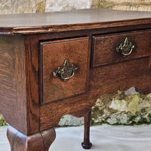 Load image into Gallery viewer, Good-colour-early-georgian-oak-side-table-lowboy-three-overlapping-drawers-ovolo-mouldings-retaining-original-brass-handles-shaped-frieze-cabriole-legs-pad-feet-solid-stable-condition-honest-attractive-useful-english-circa-1720s-for-sale-damon-blandford-antiques-stow-on-the-wold-cotswolds