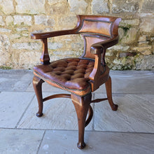 Load image into Gallery viewer, Excellent-condition-19th-century-bow-backed-elbow-captains-desk-chair-generous-proportions-incredibly-sturdy-constructed-in-oak-padded-tan-colour-hide-scroll-buttoned seat-raised-on-cabriole-legs-united-crinoline-stretcher.
Chair-very-well-constructed-noticeably-heavy-quality-timber-excellent-condition-age-related-wear-aesthetic-appeal-comfortable-supportive-large-desk-writing-table-good-quality-furniture-for-sale-damon-francis-blandford-stow-on-the-wold-cotswolds