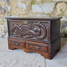 Load image into Gallery viewer, -coffer-bach-welsh-country-furniture-featuring-carved-dragon-highly-decorative-18th-century-welsh-oak-coffer-bach-lid-drawer-fronts-with-moulded-ovolo-edge-storage-space-oak-lined-drawers-overlapping-ovolo-moulding-brass-drop-handles-plinth-base-excellent-condition-for-sale-damon-blandford-antiques-stow-on-the-wold-cotswolds