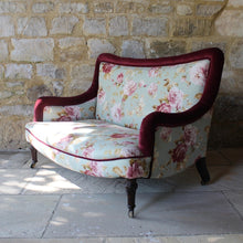 Load image into Gallery viewer, two-small-seater-upholstered-sofa-settee-turned-rosewood-legs-square-swept-concave-brass-cators-stamped-holland-&-sons-damon-blandford-antiques-chair-seating-for-sale-gloucestershire-chintz-floral-velvet-burgundy-roses-quality-fine-london-maker