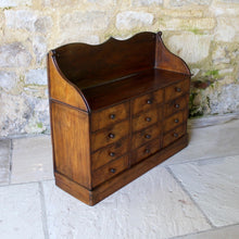 Load image into Gallery viewer, Rare bank of twelve French shop drawers in pollard oak