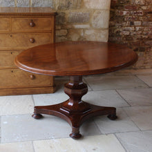 Load image into Gallery viewer, mahogany-tilt-top-table-wonderful-sun-bleached-oval-shape-top-baluster-shaped-pedestal-quadraform-base-damon-blandford-antiques-gloucestershire-cotswolds-for-sale-patina-golds-browns-reds-straw-colours-country-house-interiors-vintage-quality-timbers-breakfast-dinning-table