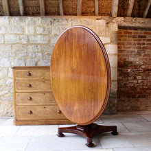 Load image into Gallery viewer, mahogany-tilt-top-table-wonderful-sun-bleached-oval-shape-top-baluster-shaped-pedestal-quadraform-base-damon-blandford-antiques-gloucestershire-cotswolds-for-sale-patina-golds-browns-reds-straw-colours-country-house-interiors-vintage-quality-timbers-breakfast-dinning-table
