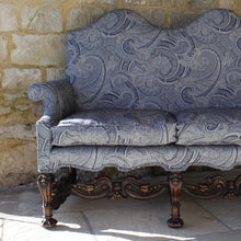Load image into Gallery viewer, jacobean-revival-settee-exceptionally-good-quality-newly-upholstered-stunning-ludhiana-wool-fabric-intricate-decoration-inspiration-traditional-indian-patterns-features-swirling-floral-design-blue-cream-colourway-seat-completely-re-built-original-horse-hair-seat-pad-feather-cushions-settee-incredibly-stylish-comfortable-carved-parcel-gilt-show-wood-legs-stretchers-foliate-design-statement-piece-english-circa-1900-damon-blandford-antiques-stroud-gloucestershire-interior-design-seating-for-sale