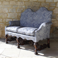 Load image into Gallery viewer, jacobean-revival-settee-exceptionally-good-quality-newly-upholstered-stunning-ludhiana-wool-fabric-intricate-decoration-inspiration-traditional-indian-patterns-features-swirling-floral-design-blue-cream-colourway-seat-completely-re-built-original-horse-hair-seat-pad-feather-cushions-settee-incredibly-stylish-comfortable-carved-parcel-gilt-show-wood-legs-stretchers-foliate-design-statement-piece-english-circa-1900-damon-blandford-antiques-stroud-gloucestershire-interior-design-seating-for-sale