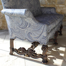 Load image into Gallery viewer, jacobean-revival-settee-exceptionally-good-quality-newly-upholstered-stunning-ludhiana-wool-fabric-intricate-decoration-inspiration-traditional-indian-patterns-features-swirling-floral-design-blue-cream-colourway-seat-completely-re-built-original-horse-hair-seat-pad-feather-cushions-settee-incredibly-stylish-comfortable-carved-parcel-gilt-show-wood-legs-stretchers-foliate-design-statement-piece-english-circa-1900-damon-blandford-antiques-stroud-gloucestershire-interior-design-seating-for-sale