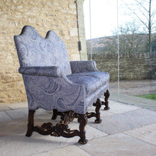 Load image into Gallery viewer, jacobean-revival-settee-exceptionally-good-quality-newly-upholstered-stunning-ludhiana-wool-fabric-intricate-decoration-inspiration-traditional-indian-patterns-features-swirling-floral-design-blue-cream-colourway-seat-completely-re-built-original-horse-hair-seat-pad-feather-cushions-settee-incredibly-stylish-comfortable-carved-parcel-gilt-show-wood-legs-stretchers-foliate-design-statement-piece-english-circa-1900-damon-blandford-antiques-stroud-gloucestershire-interior-design-seating-for-sale